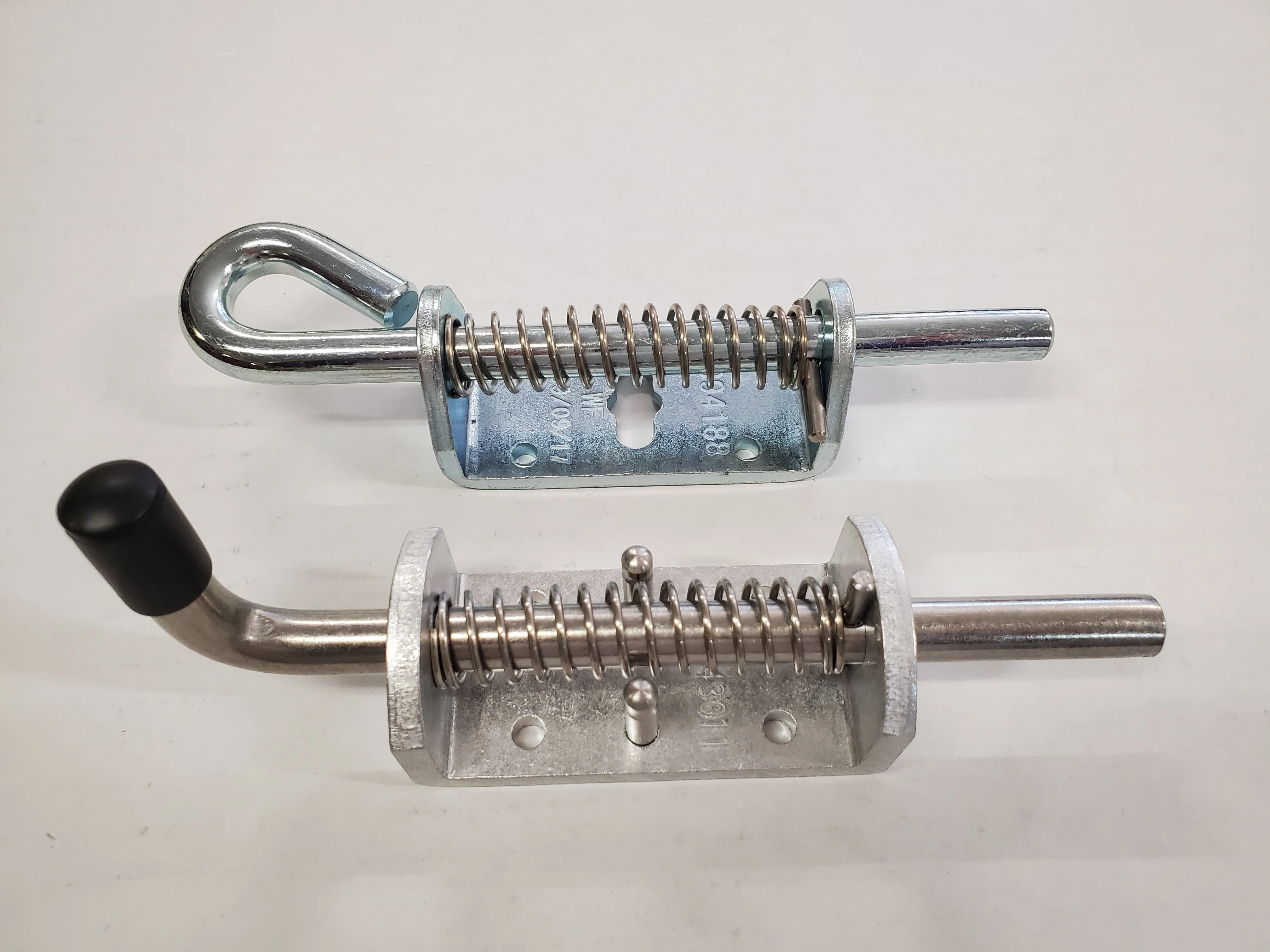 Spring-Loaded Latches With Looped Handles