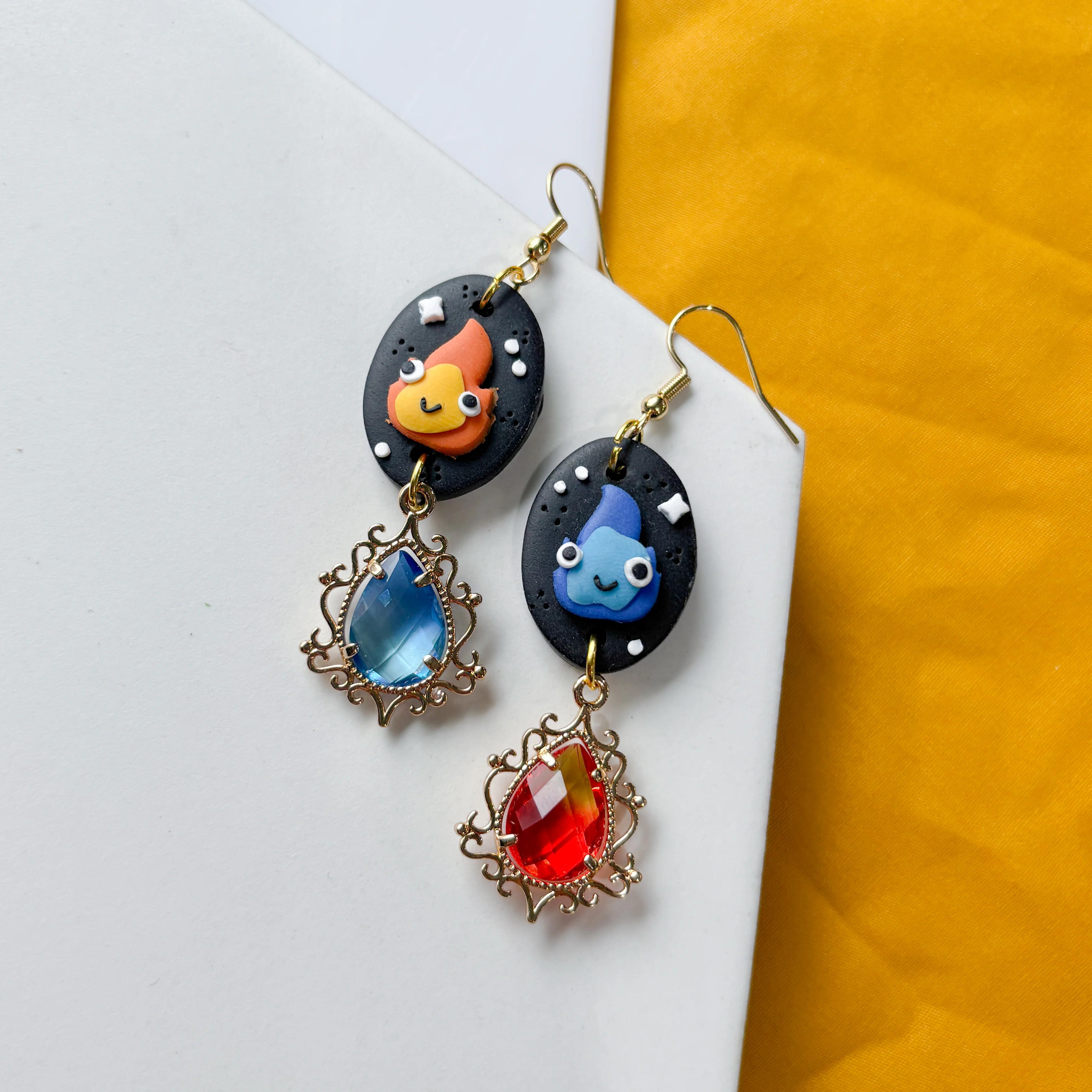 MISMATCHED FLAME SPIRIT OVAL EARRINGS - Image 1