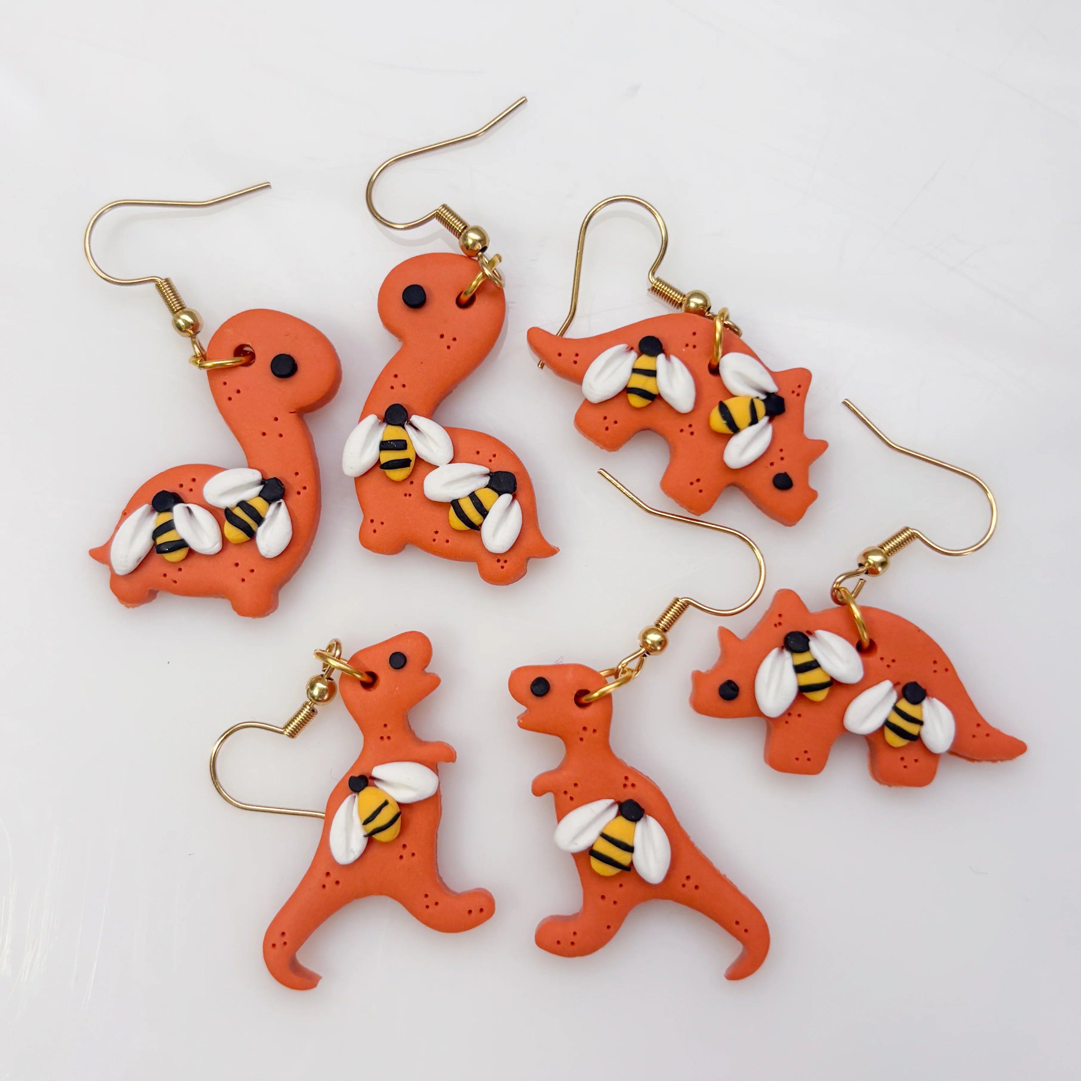 ORANGE BEE DINO EARRINGS (TRICERATOPS) - Image 3