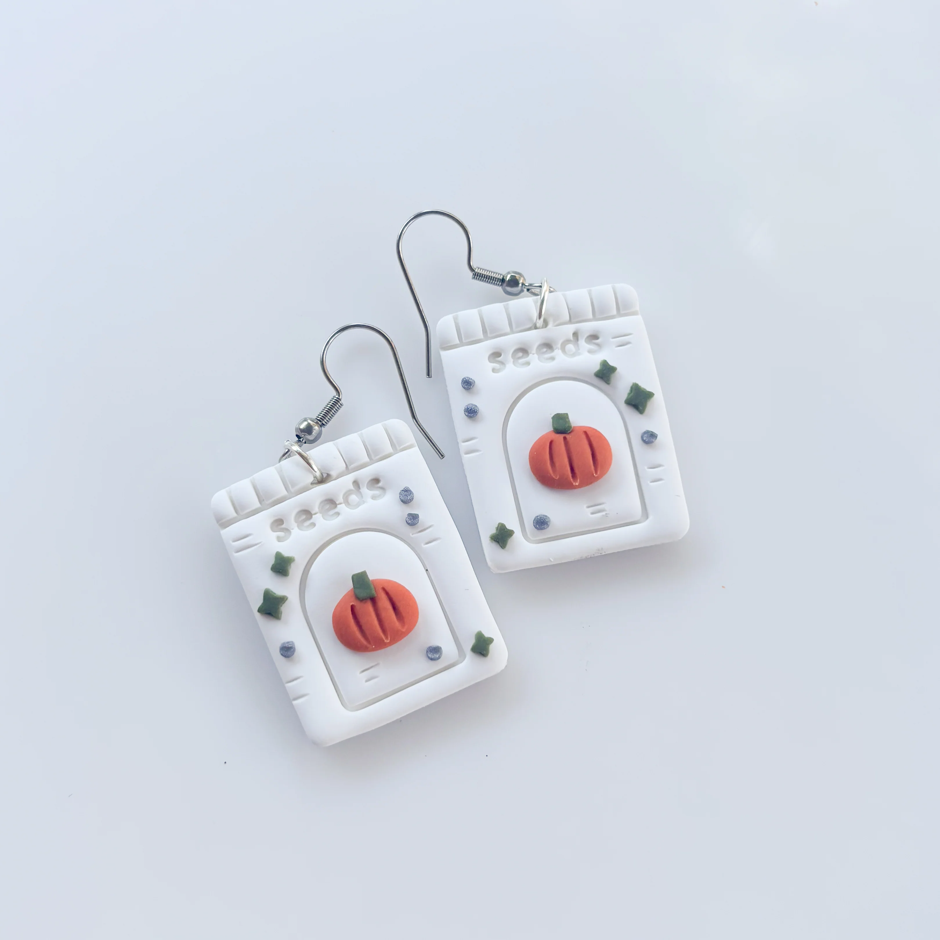 PUMPKIN SEED PACKET EARRINGS