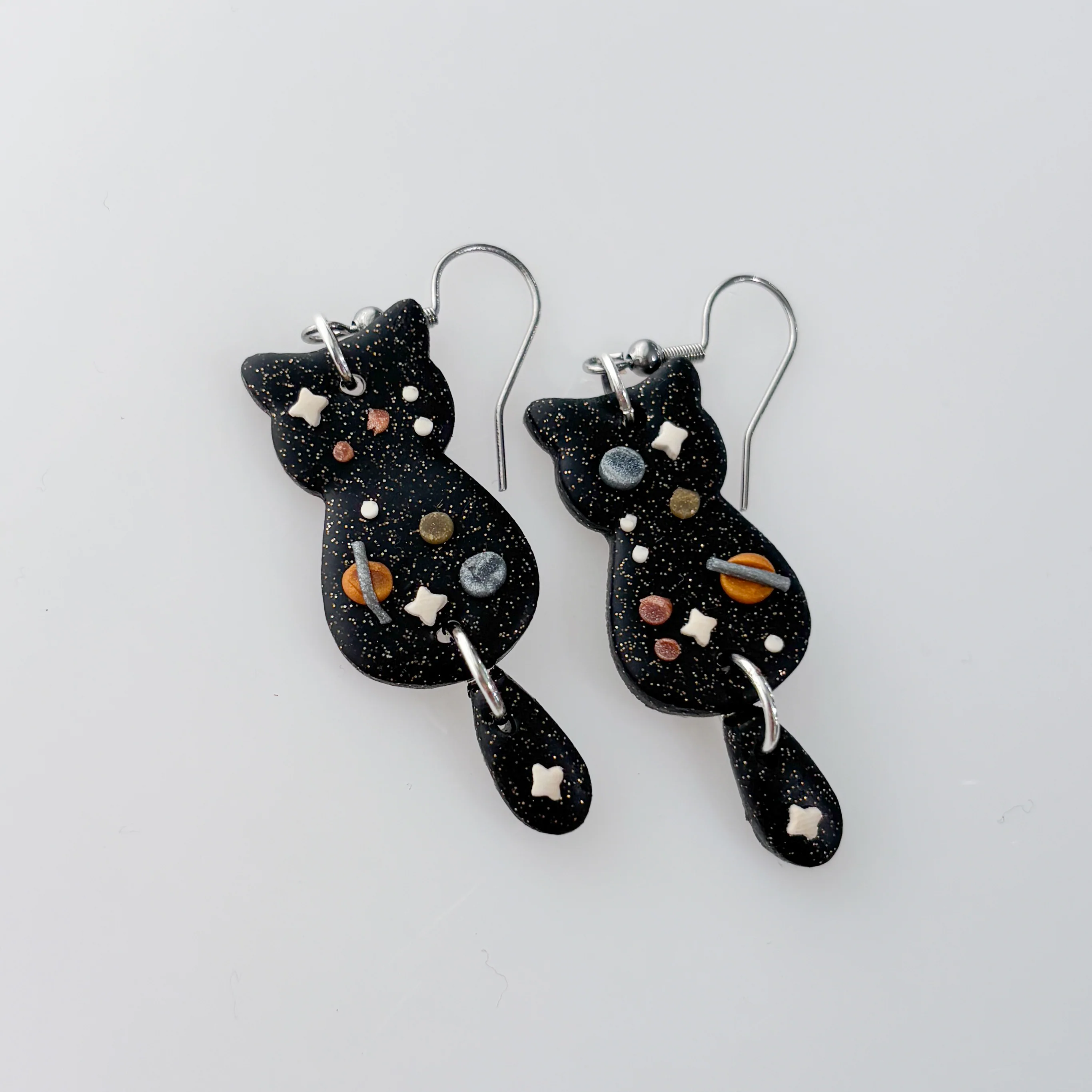 SPACE HANGING TAIL CAT EARRINGS - Image 1