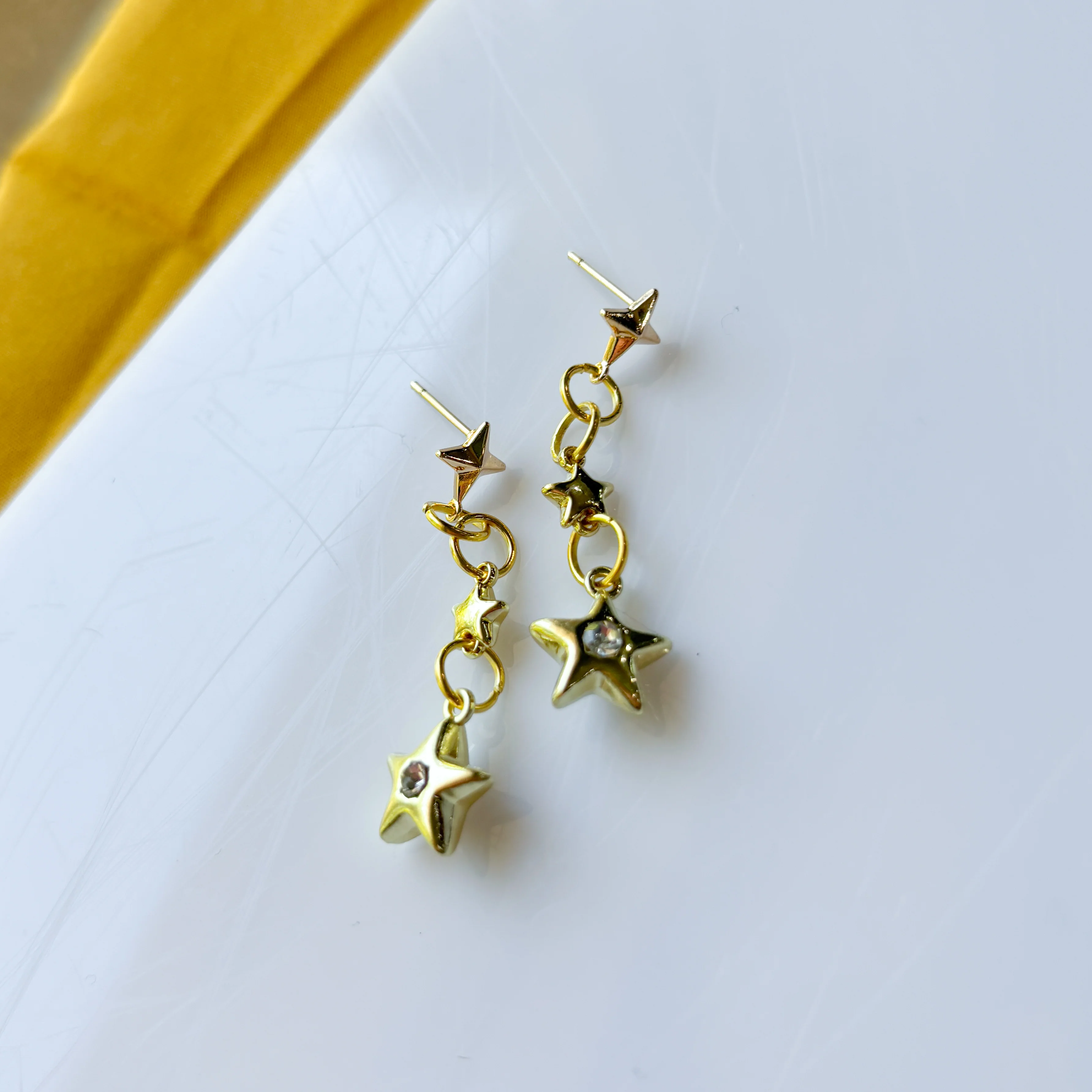 TRIPLE STAR STUD CHARM EARRINGS - Image 1