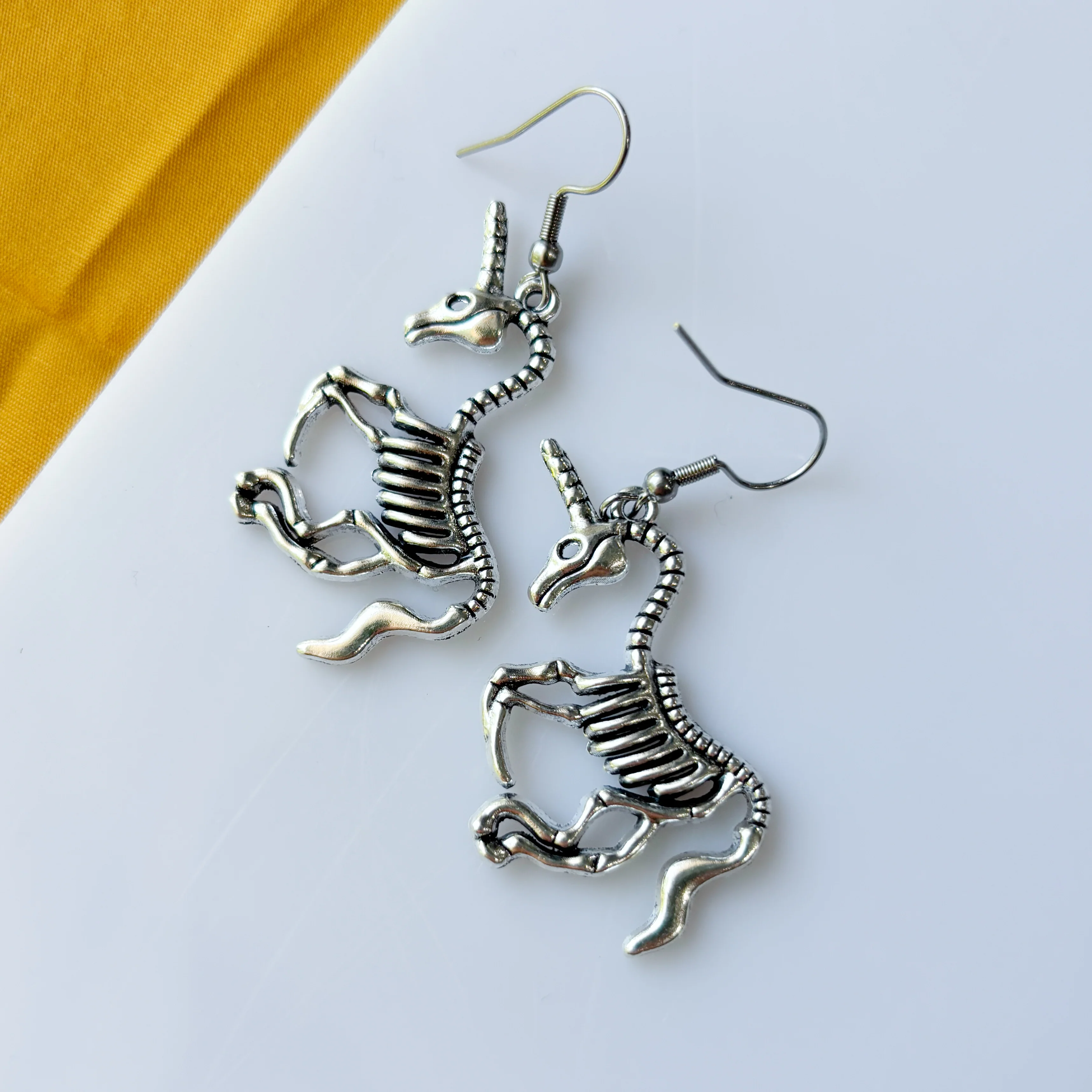 UNICORN SKELETON CHARM EARRINGS - Image 1