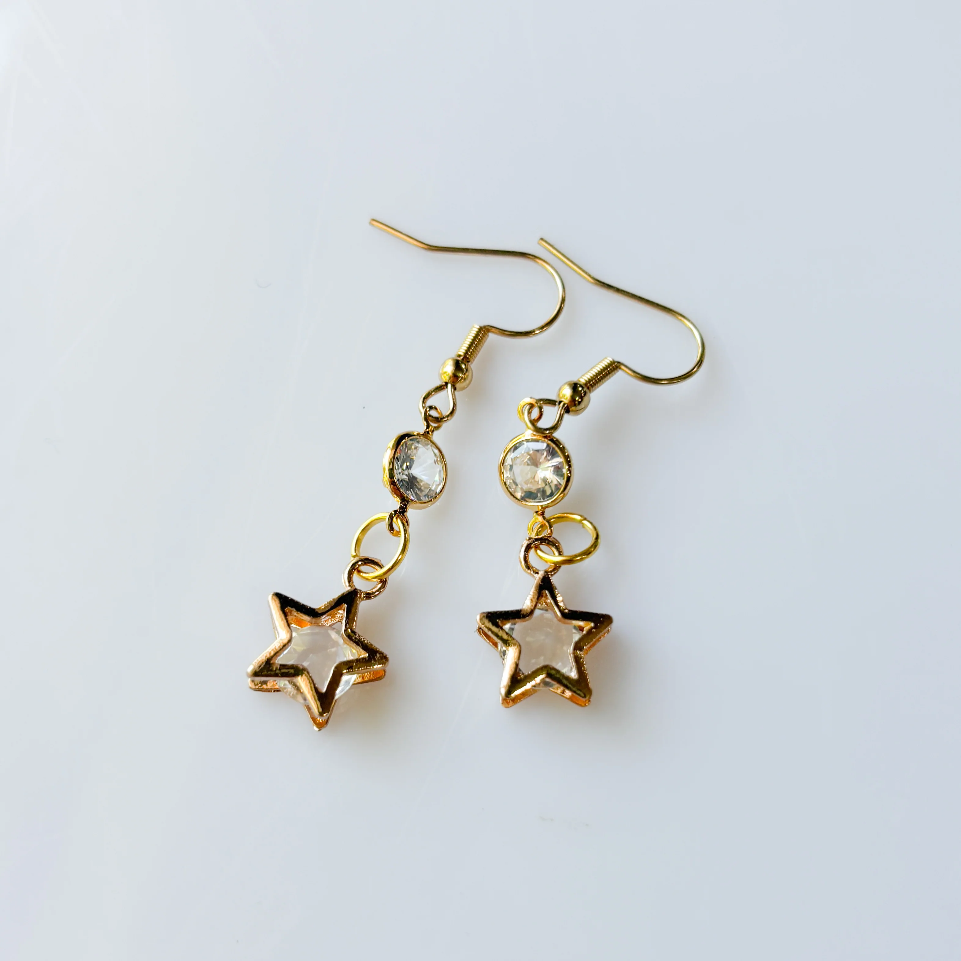 CRYSTAL CIRCLE & STAR CHARM EARRINGS - Image 1
