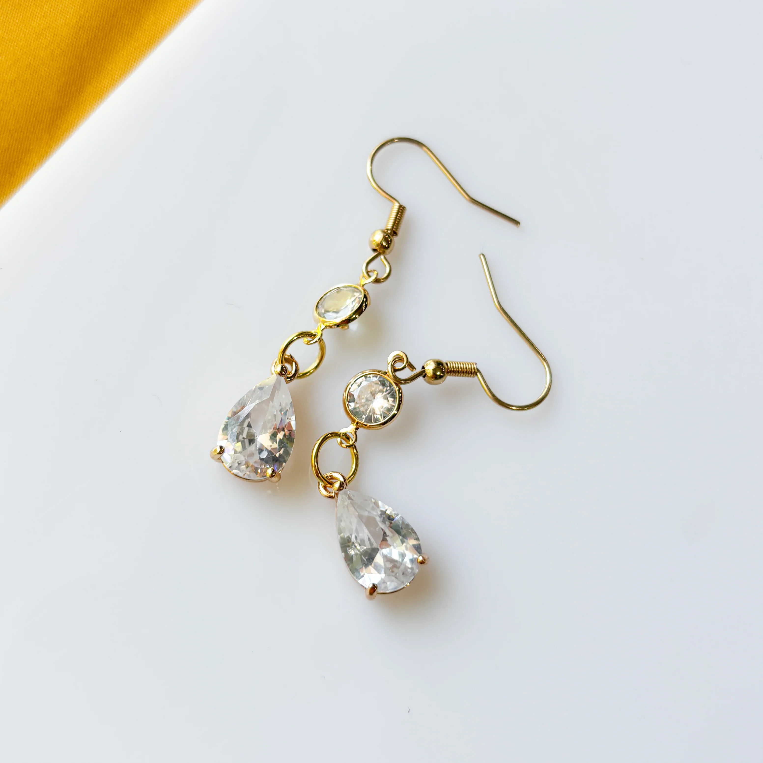 GOLD CRYSTAL TEARDROP CHARM EARRINGS - Image 1