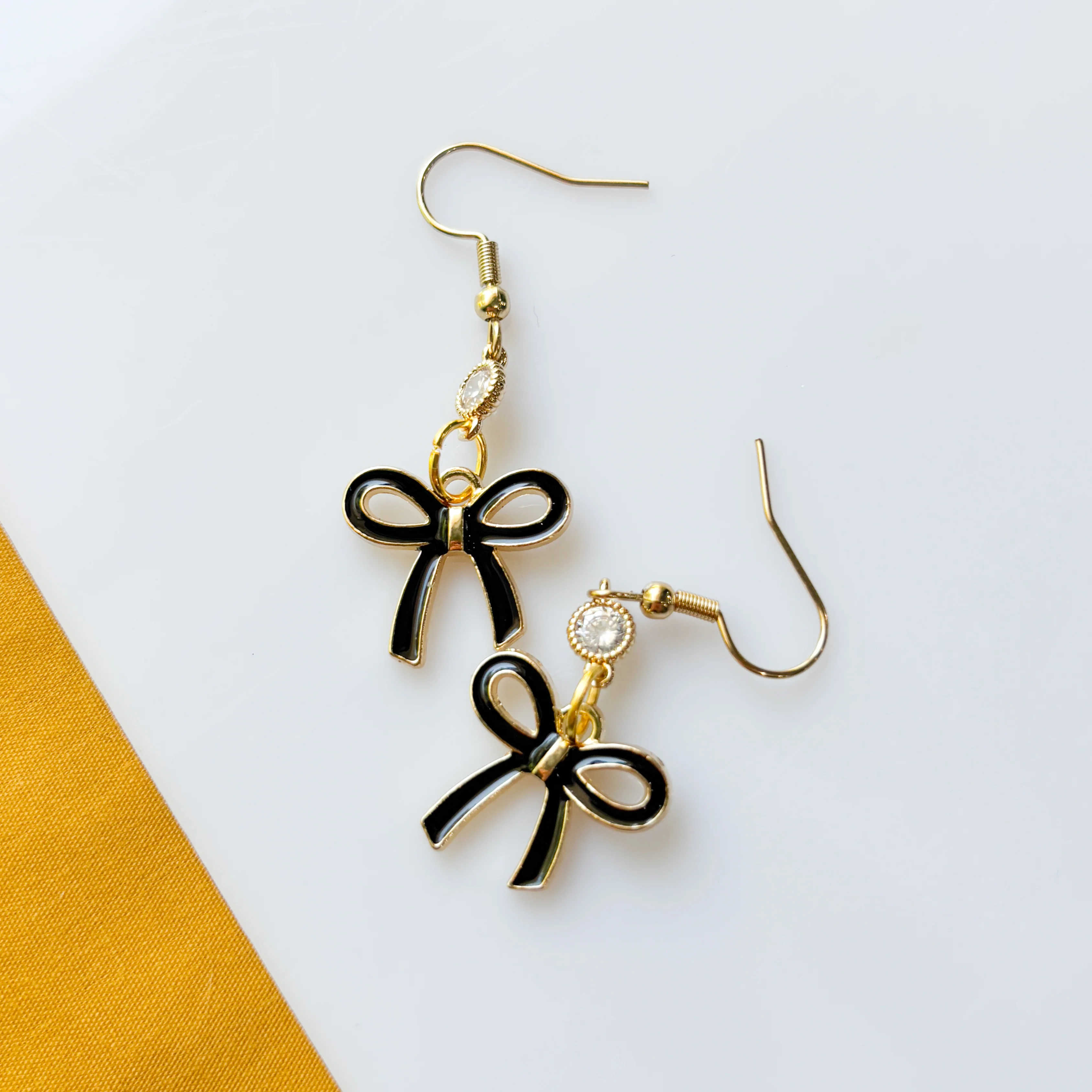 BLACK BOW CHARM EARRINGS - Image 2