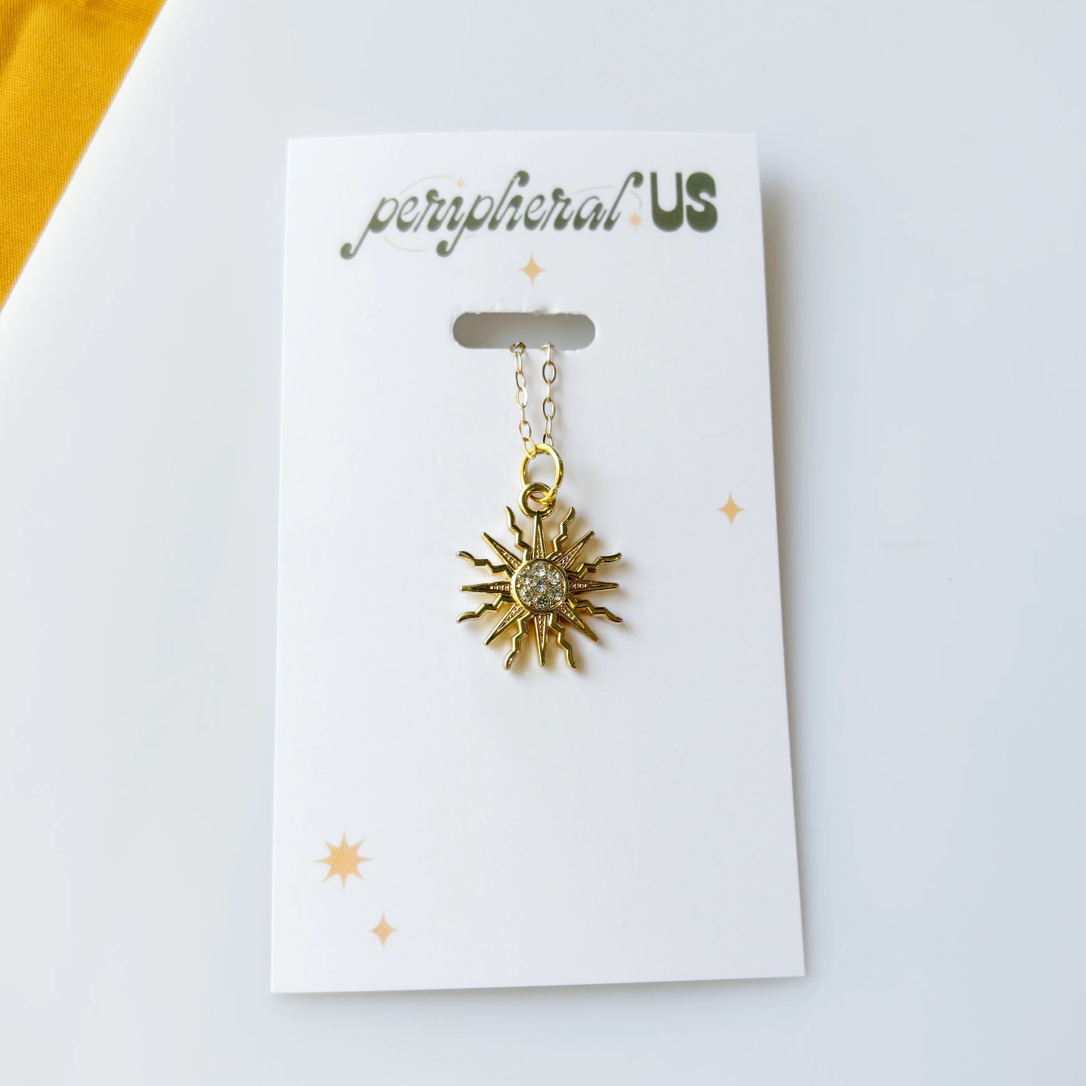 CELESTIAL SUN CHARM NECKLACE