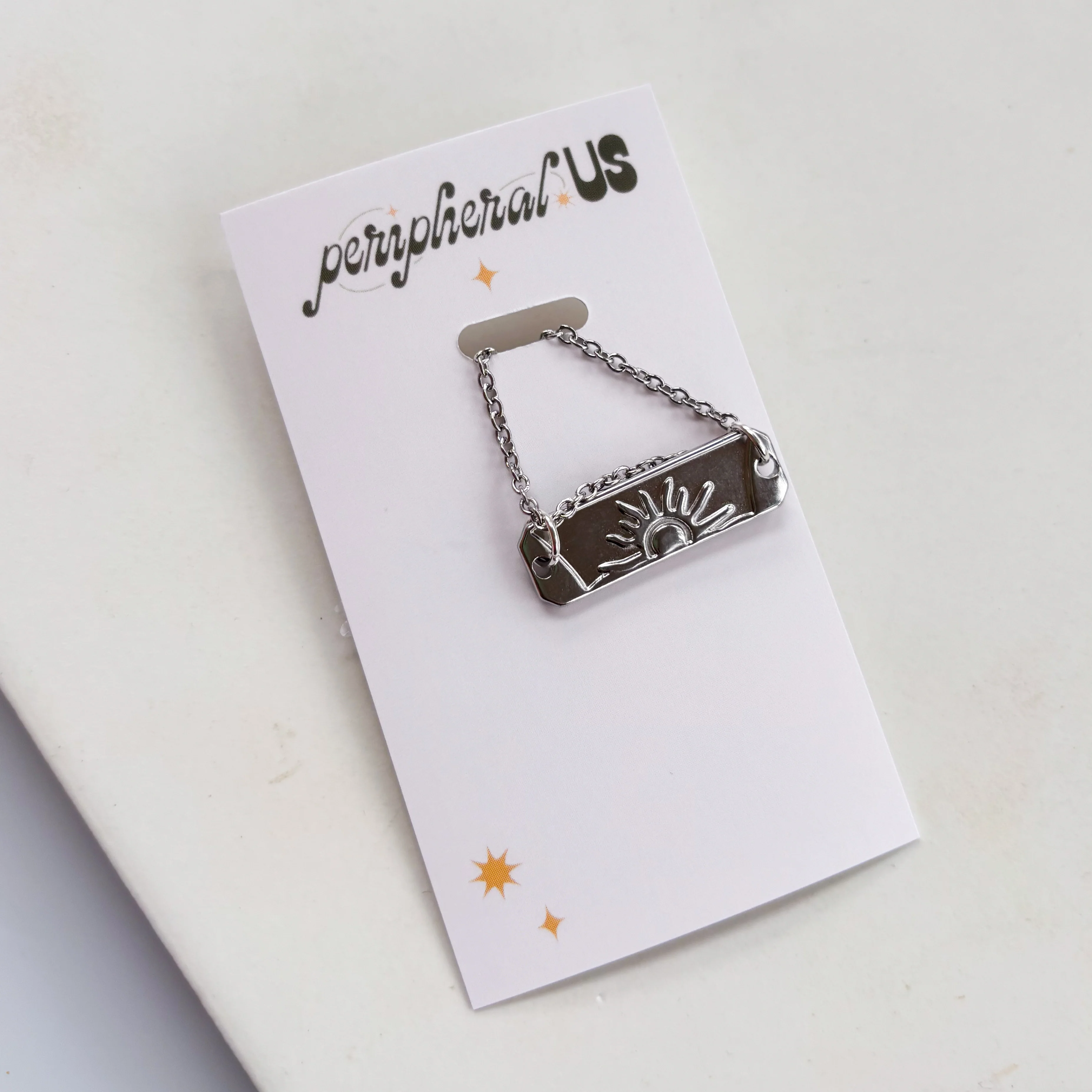 SILVER SUN CHARM NECKLACE