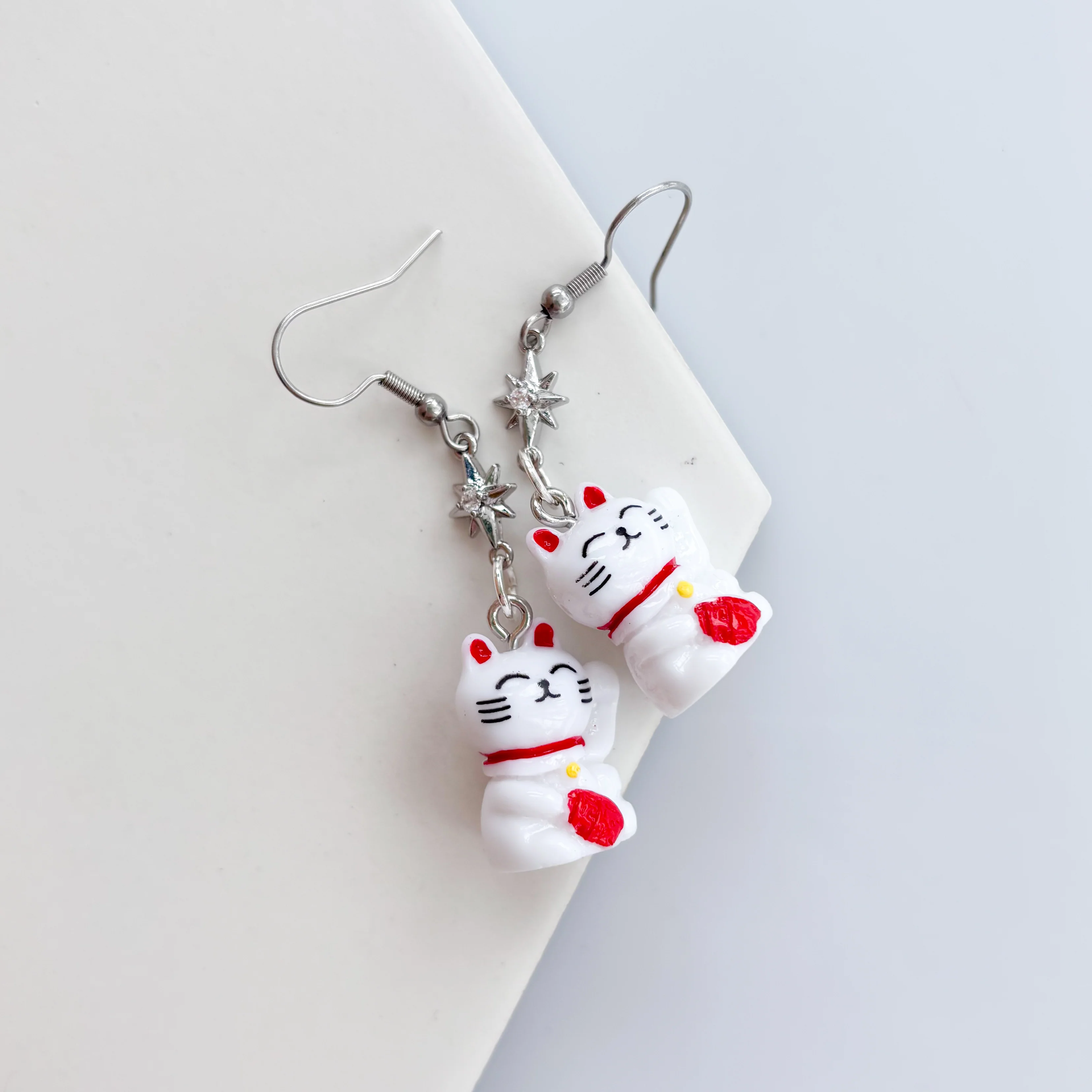 LUCKY CAT SILVER STAR CHARM EARRINGS - Image 1