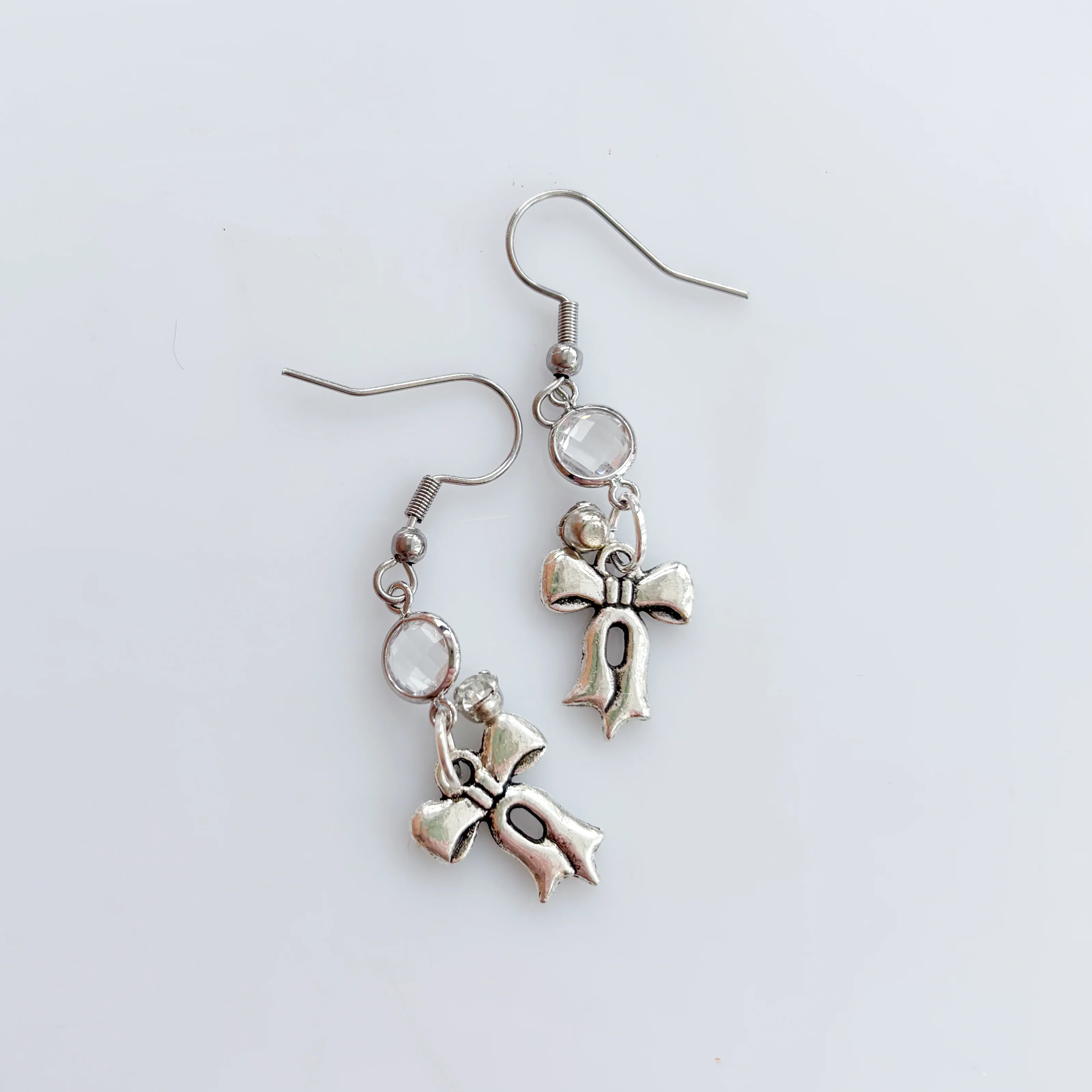 LITTLE SILVER BOW CHARM EARRINGS - Image 2