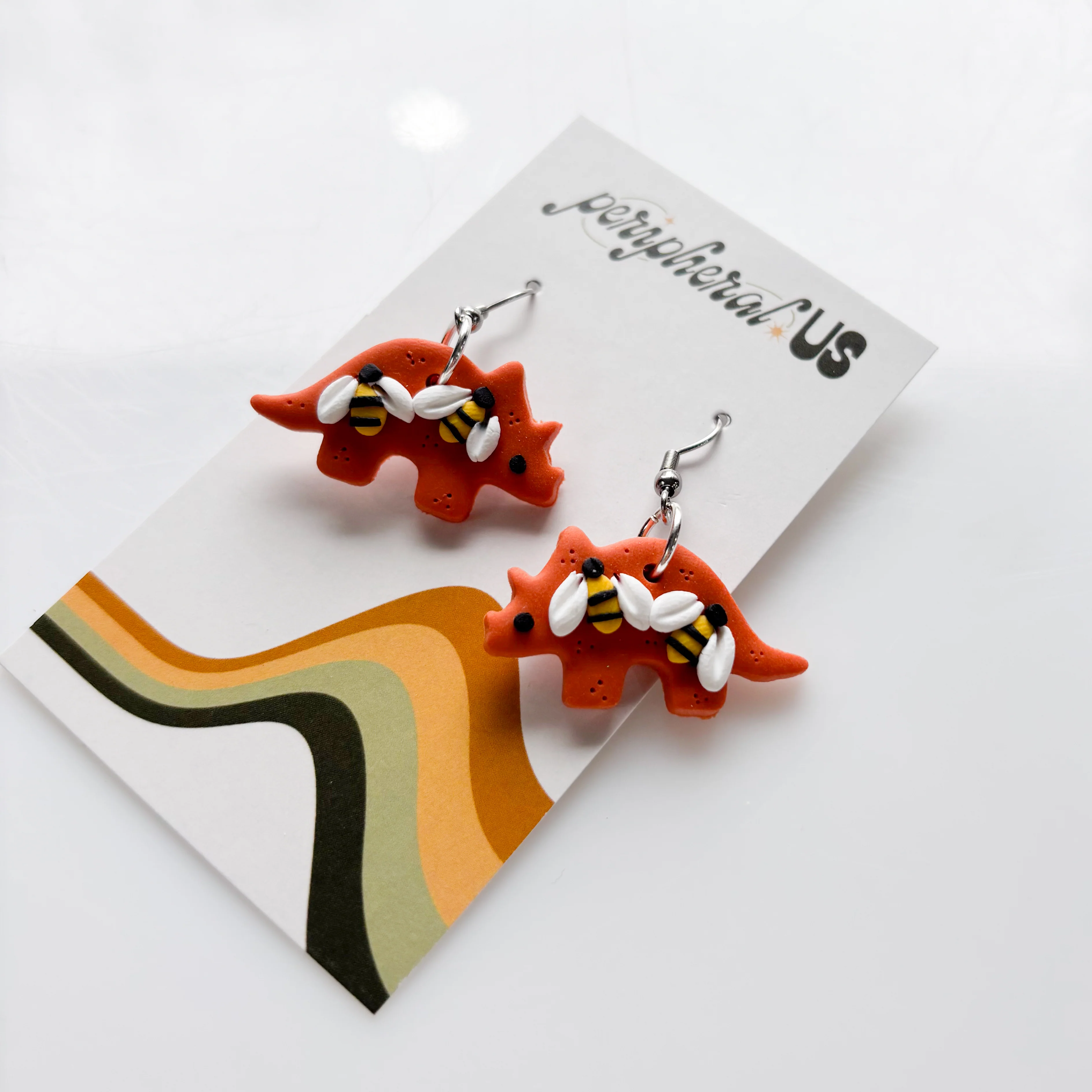 ORANGE BEE TRICERATOPS EARRINGS