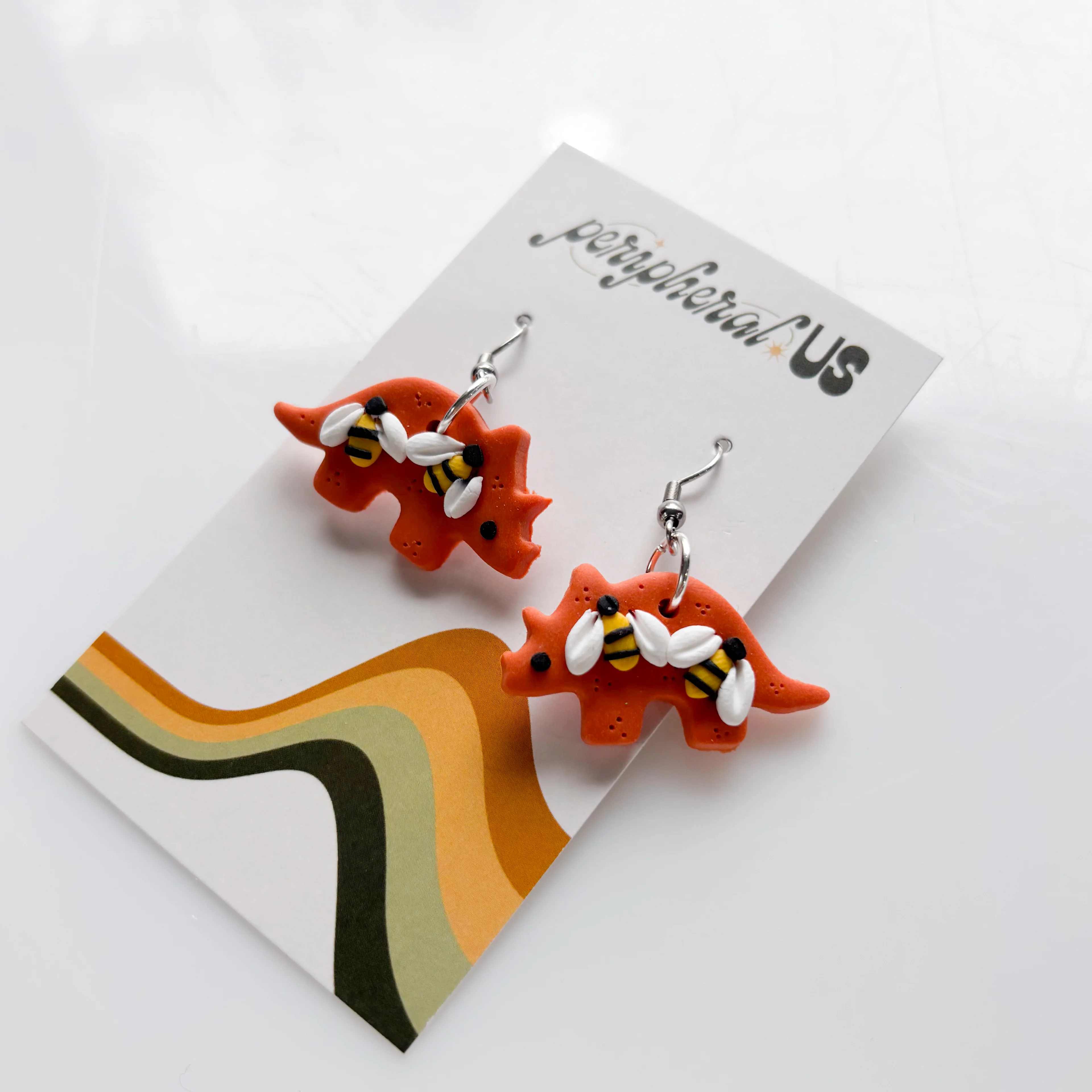 ORANGE BEE TRICERATOPS EARRINGS - Image 2