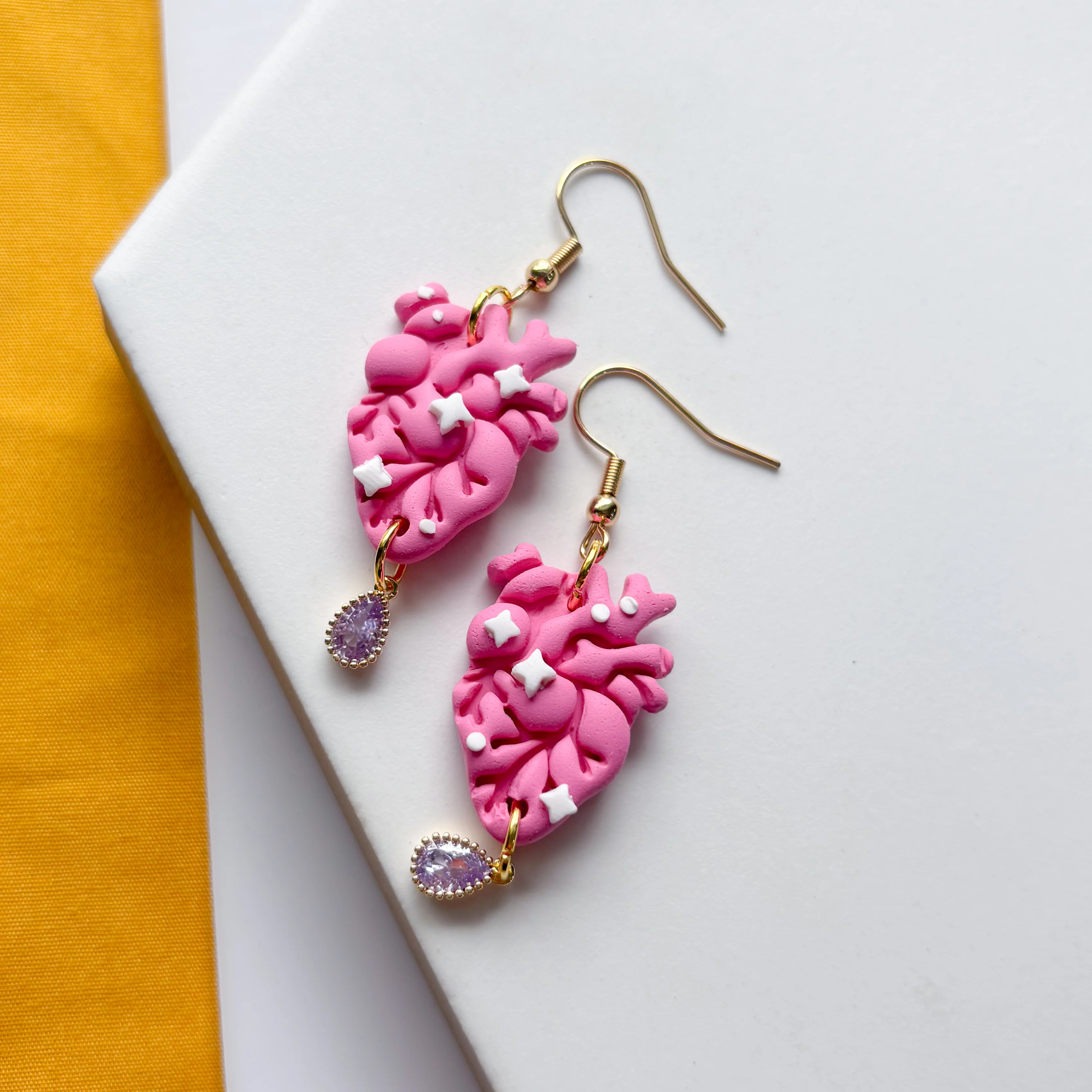 PINK SPARKLE ANATOMICAL HEART EARRINGS - Image 1
